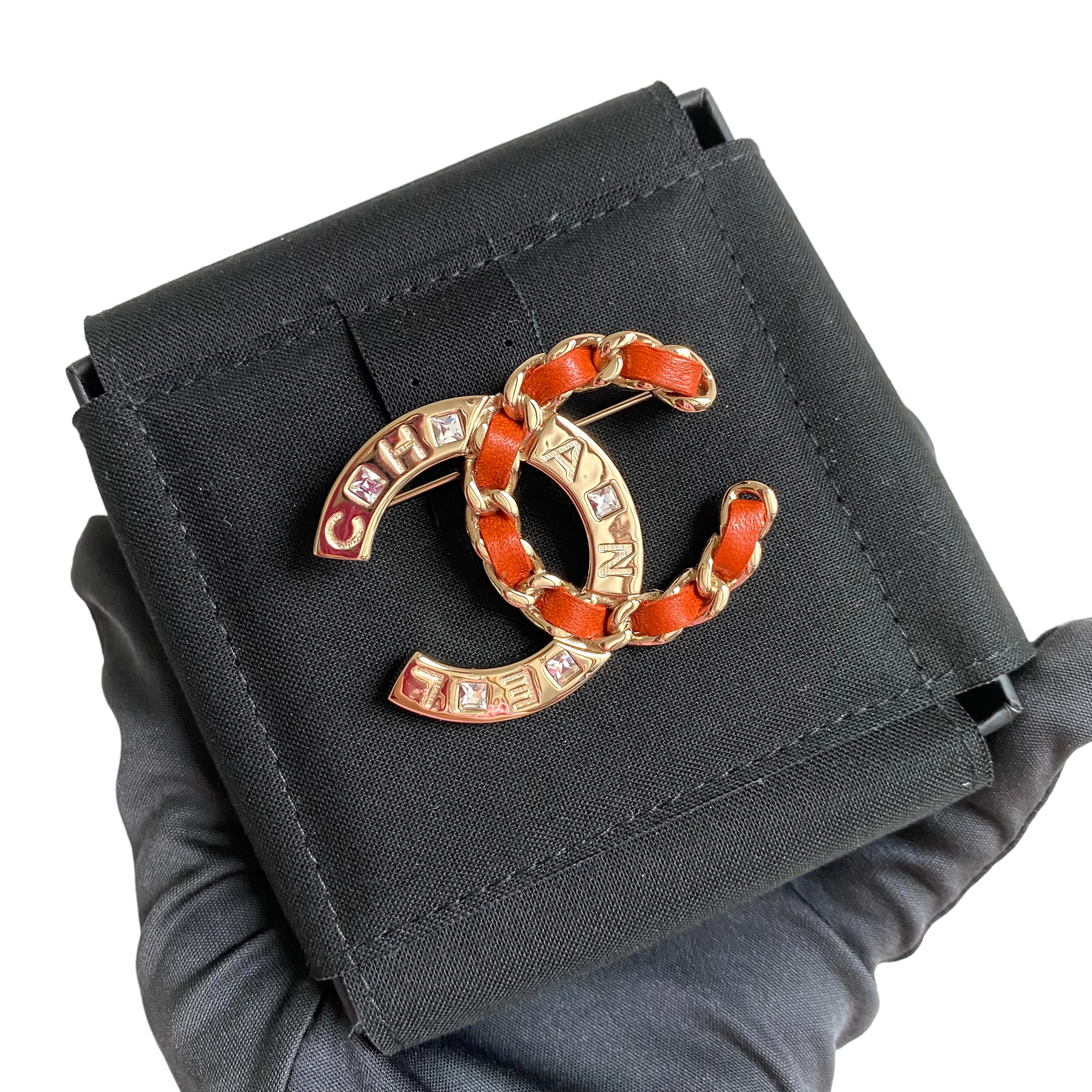 Chanel Red Leather Threaded Chain Crystal CC Logo Brooch | Dearluxe
