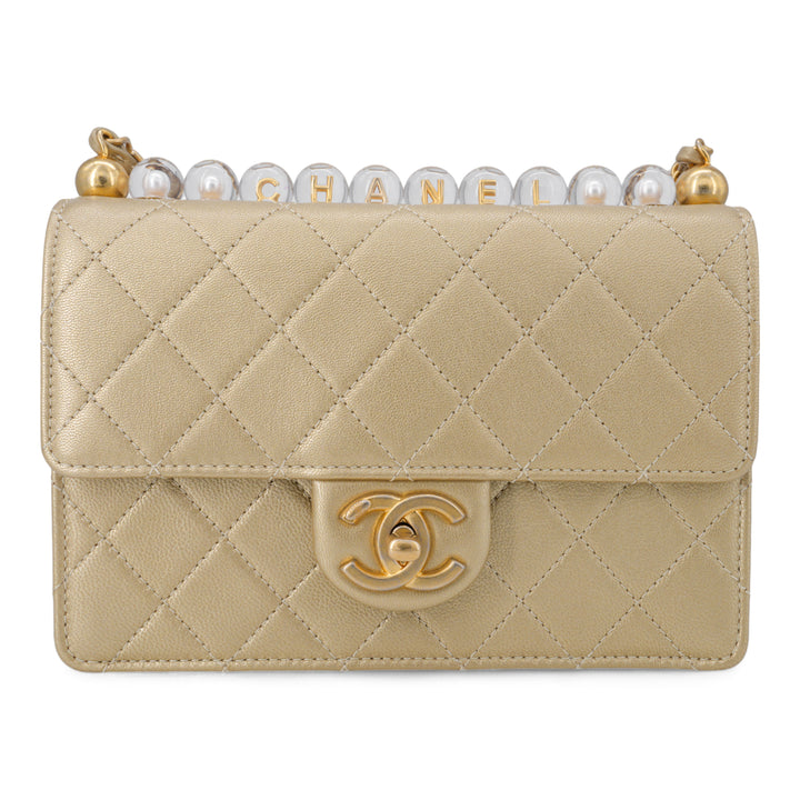 CHANEL Gold Quilted Small Chic Pearls Flap Bag - Dearluxe.com