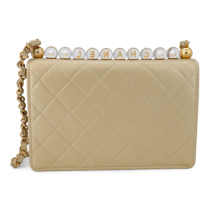 CHANEL Gold Quilted Small Chic Pearls Flap Bag - Dearluxe.com