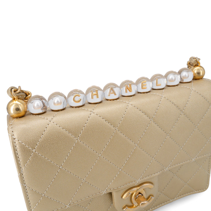 CHANEL Gold Quilted Small Chic Pearls Flap Bag - Dearluxe.com