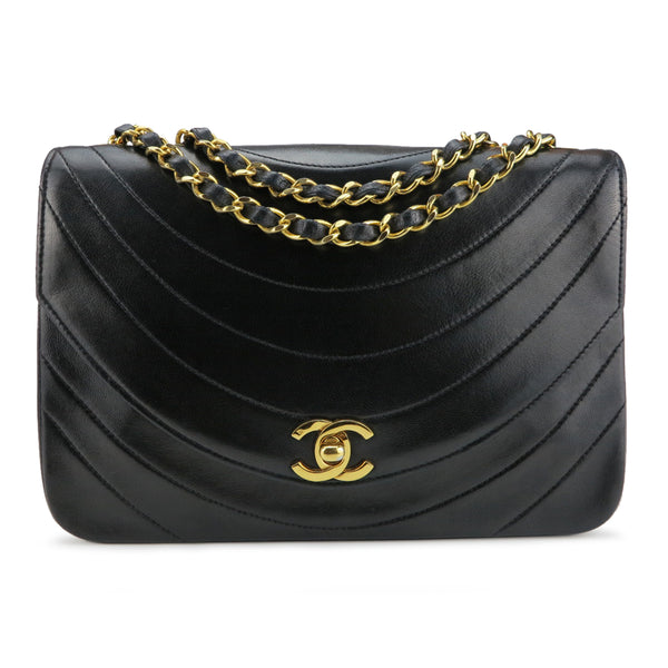 CHANEL Vintage Curve Quilted Flap Bag in Black Lambskin - Dearluxe.com