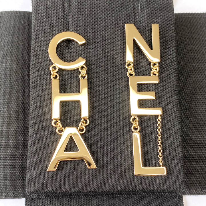 CHANEL Metal CHA-NEL Letter Logo Statement Dangle Earrings - Dearluxe.com