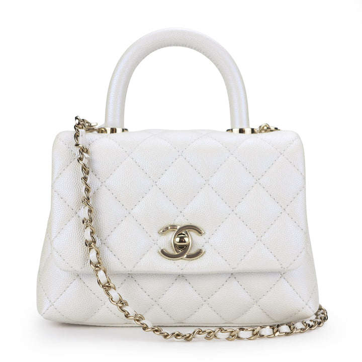 CHANEL Extra Mini Coco Handle Flap Bag in 20K Iridescent White Caviar - Dearluxe.com