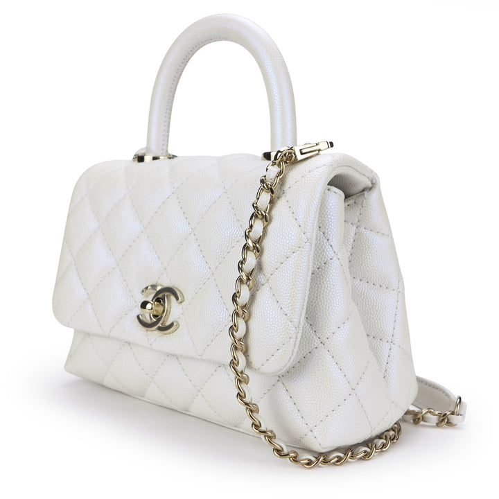 CHANEL Extra Mini Coco Handle Flap Bag in 20K Iridescent White Caviar - Dearluxe.com