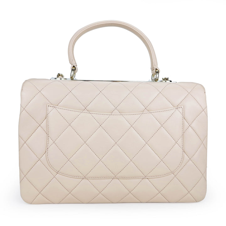 CHANEL Medium Trendy CC Flap Bag with Top Handle in 21S Light Beige Lambskin - Dearluxe.com